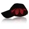 A black hat with hair growth cap lights on it.
