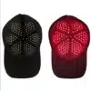 A hair growth cap in black and red with a red light.