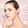 A woman is holding a REDi Wand in her hand.