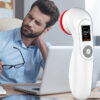 A man is sitting at a desk with a REDi CureRay Pro in front of him., red light therapy professional hand held device, red light panel