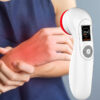 A woman is holding a REDi CureRay Pro on her wrist., red light panel, red light therapy professional hand held device